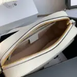 there is a front pocket for easy access to your essentials.This bag is designed to accommodate a cell phone up to 3.1″ W x 6.6″ H x 0.4″ D