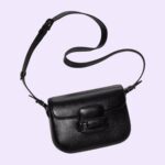the monotone hardware is paired with black leather and the bag is enriched with two detachable shoulder straps