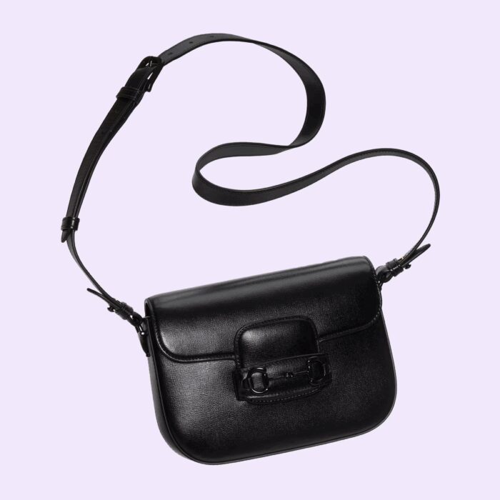 the monotone hardware is paired with black leather and the bag is enriched with two detachable shoulder straps