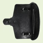 changing between a shoulder and a top handle bag. Made in matelassé chevron leather