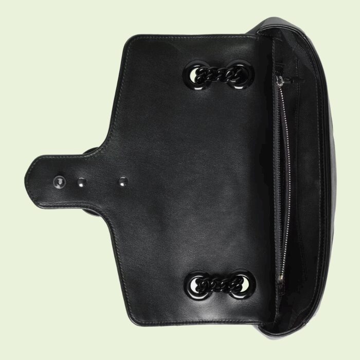 changing between a shoulder and a top handle bag. Made in matelassé chevron leather
