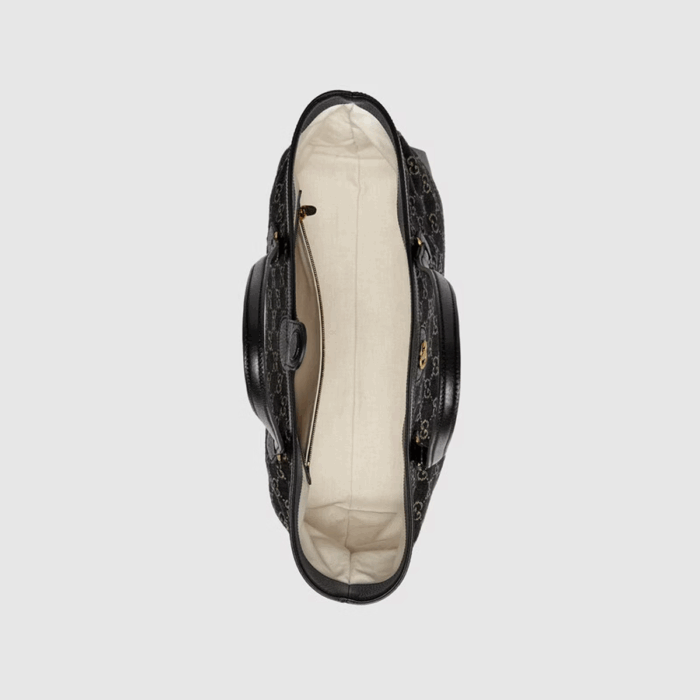the monogram is presented with a contemporary feel in black and ivory denim.
