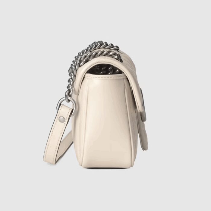 the mini shoulder bag is reimagined with a new geometric take on its signature finish that combines vertical and diagonal motifs.