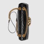 changing between a shoulder and a top handle bag. Made in matelassé chevron leather with a heart on the back.