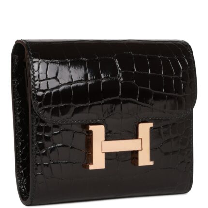 a metal "H" snap lock closure and one rear exterior pocket.