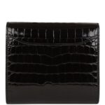 The interior is lined with black leather and has a front slit pocket