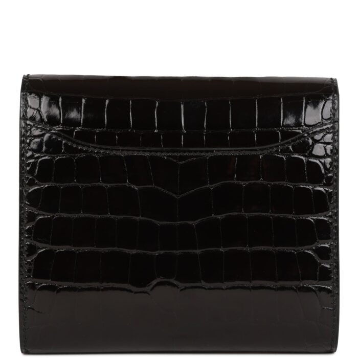 The interior is lined with black leather and has a front slit pocket