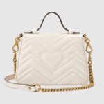 made in matelassé chevron leather with a heart on the back.