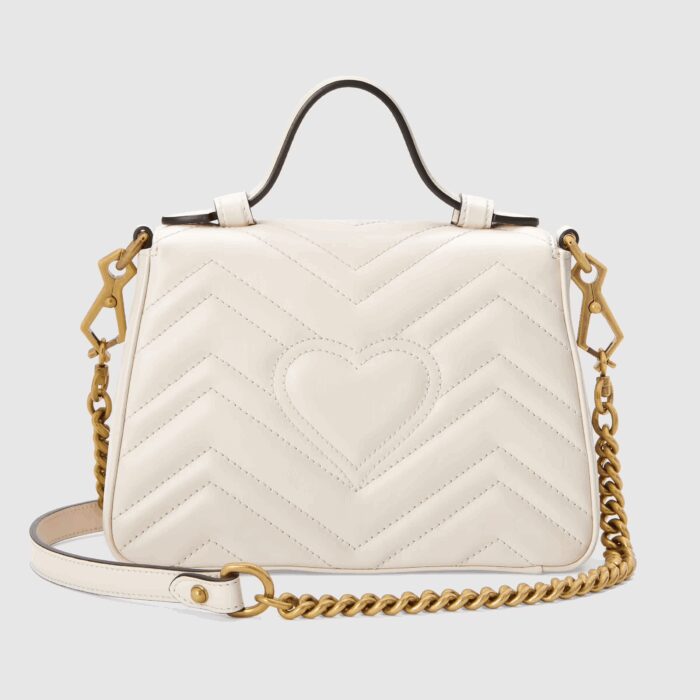 made in matelassé chevron leather with a heart on the back.