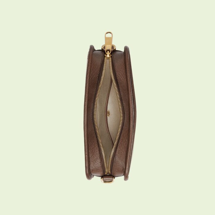 the collection presents contemporary takes on traditional pieces. This mini bag is presented in GG canvas - a reimagination of Guccio Gucci's initials in a maxi size.