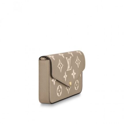 embossed with Louis Vuitton's iconic Monogram pattern. The two-tone palette brings added refinement to this elegant and versatile design