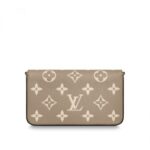 which features a removable gold-tone chain that allows it to be carried on the shoulder or as a clutch