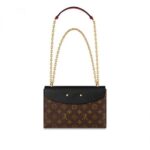 accented with a golden clasp borrowed from historic Louis Vuitton trunks. The sliding chain is fitted with a leather pad for comfort and adjusts to shoulder- or cross-body length. Perfect for day-to-evening wear