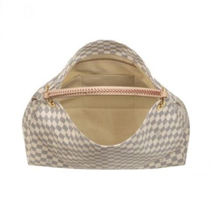 its exquisite handcrafted leather handle adds a luxurious crowning touch.