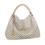 The Artsy GM looks fresh and feminine in supple Damier Azur canvas. Adorned with shiny golden brass and a chic bag charm