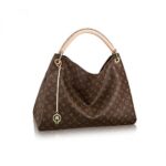 The Artsy MM embodies understated bohemian style. Louis Vuitton's iconic and divinely supple Monogram canvas is enhanced by rich golden color metallic pieces and an exquisite handcrafted leather handle.16.14 x 12.60 x 8.66 inches(Length x Height x Width)•Monogram coated canvas•Microfiber lining•Gold-color hardware•Reinforced leather handle with cross stitching for shoulder or elbow carry•Large inside zipped pocket•6 inside flat pockets (3 on each side)•Keybell with key ring and hook•4 protective bottom studsMore Information