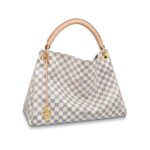 The Artsy MM looks fresh and feminine in supple Damier Azur canvas. Adorned with shiny golden brass and a chic bag charm