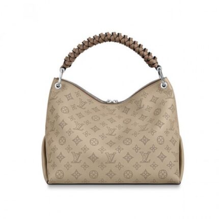 with hand-painted edge-dyeing along the braids. The leather zip pulls and large LV charm signs the bag. A detachable
