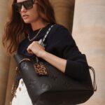 Detailed Features31 x 28 x 14 cm(Length x height x width )•Cream•Embossed supple-grained cowhide leather• Supple-grained cowhide-leather trim•Microfiber lining•Gold-color hardware•4 leather side laces•Snap hook closing to secure belongings•Inside large zipped pocket•Removable animal-print leather zipped pouch•Removable animal-print leather name tag•Handle: DoubleMore Information
