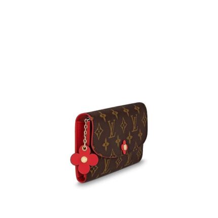 while its distinctive press stud is transformed into a Monogram Flower. This envelope-style wallet opens to reveal a variety of user-friendly features
