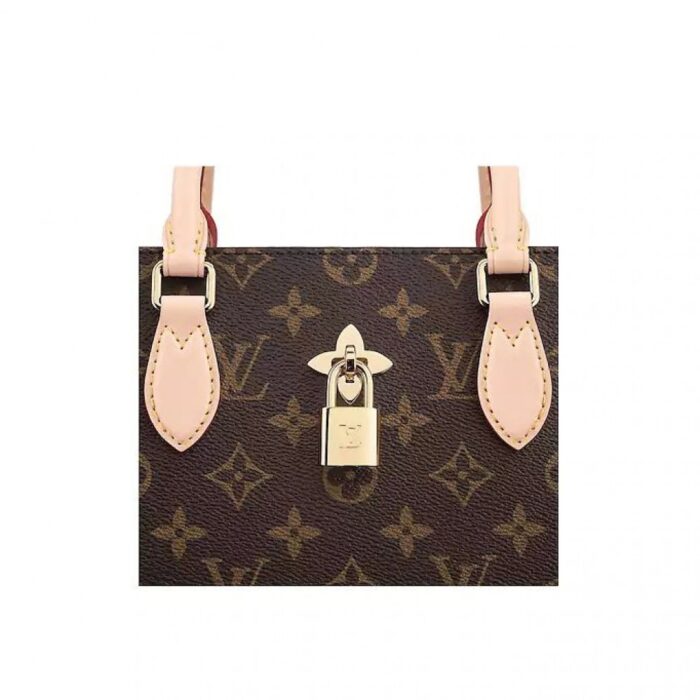 and the well-organized interior easily holds files and a laptop.DETAILED FEATURES•13.4 x 9.5 x 5.1 inches•Monogram coated canvas•Smooth calf-leather trim•Microfiber lining•Golden-color metallic pieces•Adjustable