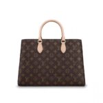 removable leather shoulder strap•2 articulated Toron leather handles•Flower-shaped padlock•Central compartment with zipped closure•2 flat inside pockets•Keybell•4 protective bottom studs