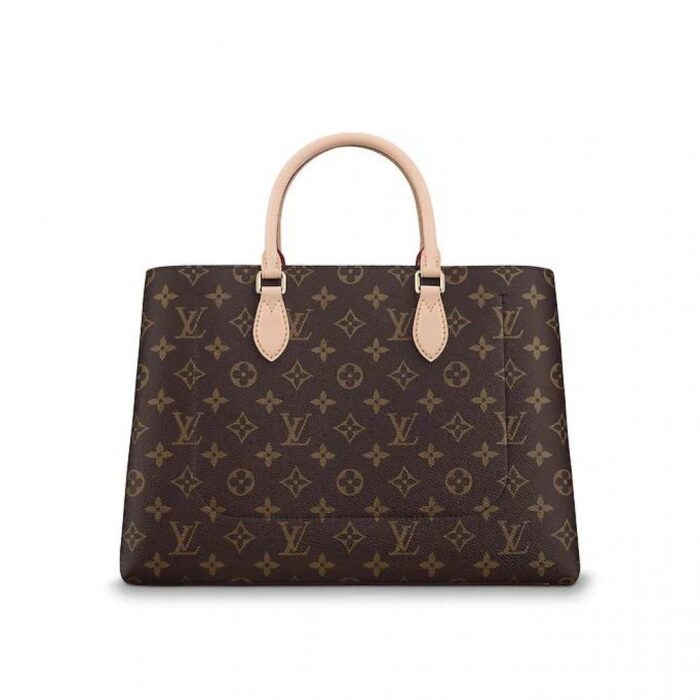 removable leather shoulder strap•2 articulated Toron leather handles•Flower-shaped padlock•Central compartment with zipped closure•2 flat inside pockets•Keybell•4 protective bottom studs