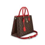and the well-organized interior easily holds files and a laptop.DETAILED FEATURES•13.4 x 9.5 x 5.1 inches•Monogram coated canvas•Smooth calf-leather trim•Microfiber lining•Golden-color metallic pieces•Adjustable