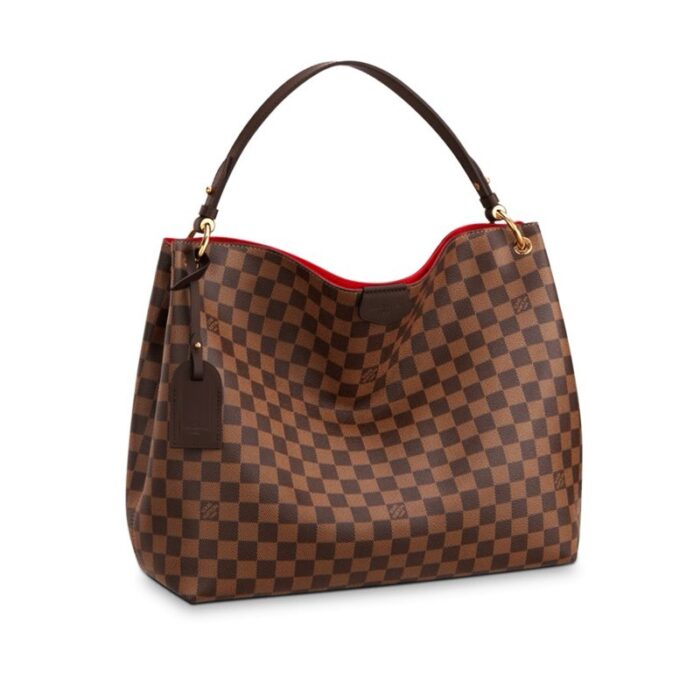 16 x 12 x 4 inches•Flat leather shoulder handle with decorative golden brass rivets•Magnetic leather patch closure•1 interior zipped pocket•1 name tag•Damier Ebene coated canvas•Cotton canvas lining•Cowhide leather trim•Golden color metallic pieces