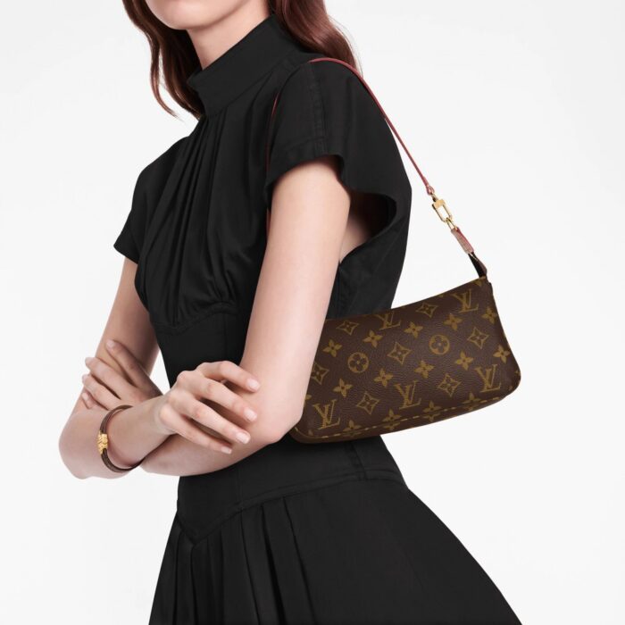 this interpretation of the Pochette Accessoires can accommodate a Zippy Wallet. In Monogram canvas