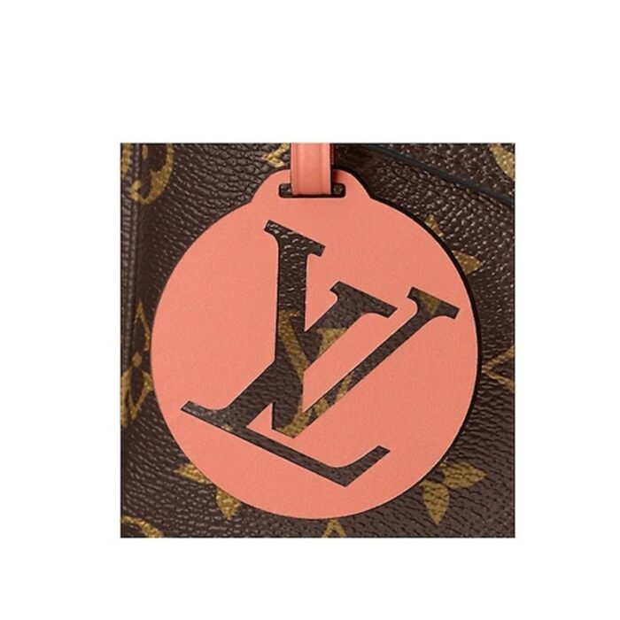 accented with an oversized LV leather charm. Furnished with a detachable strap for hands-free carry.