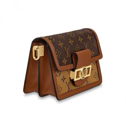 trimmed with smooth tan calfskin. The high-shine LV lock and leather smart strap add a modern twist to this signature piece
