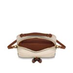 either carried by the supple top handle or suspended from the adjustable shoulder strap.Detailed Features8.66 x 6.30 x 3.15 inches(Length x Height x Width)•Crème Beige and Caramel•Embossed supple grained cowhide leather and supple grained cowhide leather•Supple grained cowhide leather trim•Microfiber lining•Gold-color hardware•Top handle•Adjustable strap (drop: min. 56 cm/22 inches