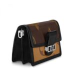 trimmed with edgy black calf. It features a bold