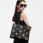 sans-serif; font-size: 16px; background-color: #ffffff;">The OnTheGo MM is a medium-sized tote bag with two sets of handles