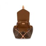 it features an outside zipped pocket. The top handle and adjustable leather straps allow multiple carry options.Detailed Features10.8 x 13 x 5.5 inches(Length x Height x Width)•Aged Natural Leather•Monogram coated canvas•Cowhide-leather trim•Textile lining•Gold-color hardware•Two adjustable leather straps (length: min. 77 cm/30.3 inches