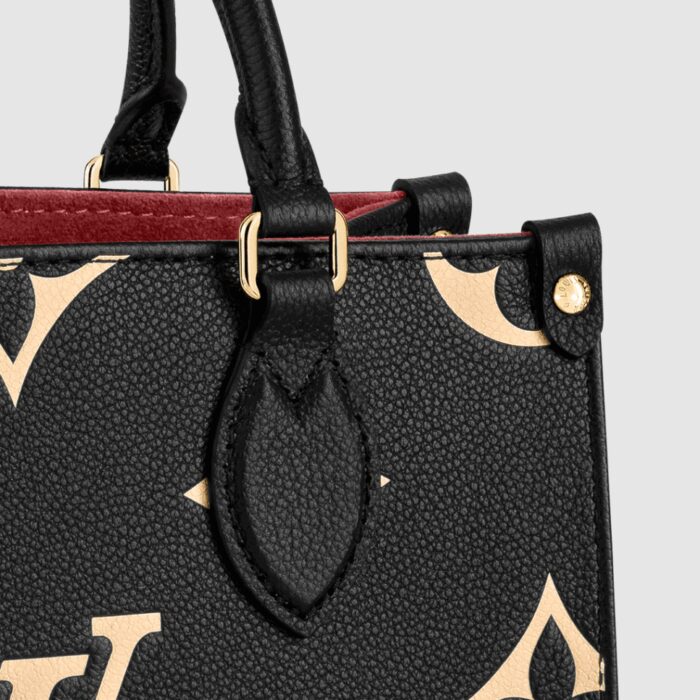 the OnTheGo PM tote is fashioned in Monogram Empreinte leather