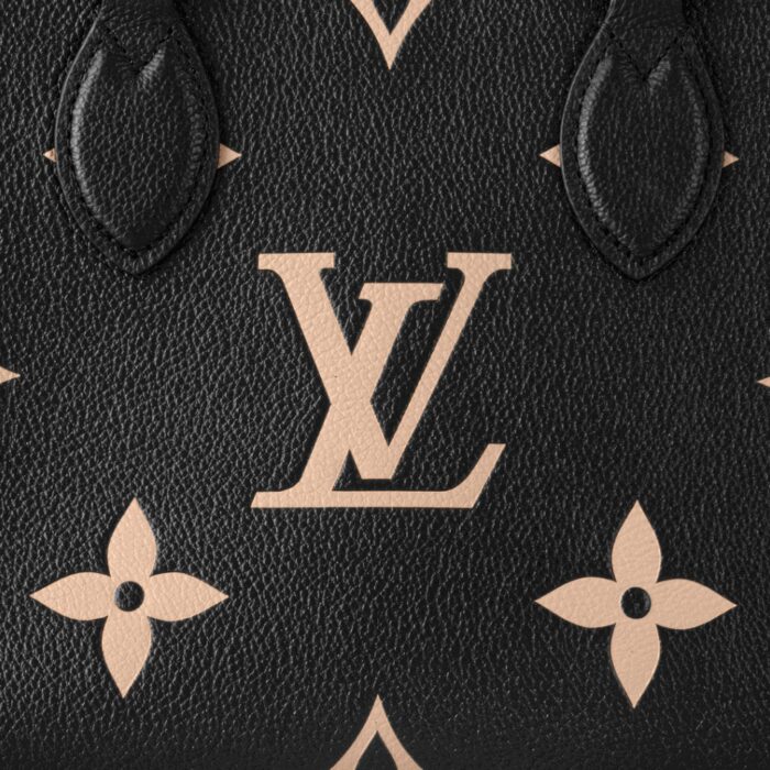embossed with a Medium Bicolor Monogram pattern. This smaller version of the original OnTheGo fits essentials such as an iPad Mini. Articulated top handles and an adjustable removable strap offer a variety of carry options.