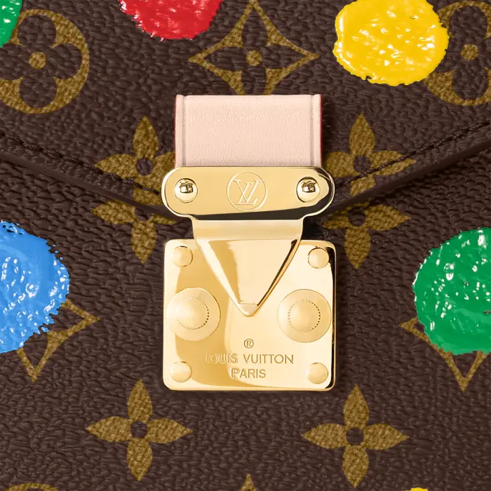 the LVxYK Pochette Métis is an upbeat variation on a classic bag. Monogram canvas is enlivened with one of the visionary Japanese artist’s signature themes: an array of brightly colored dots