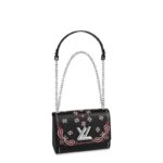 Louis Vuitton reinvents the flowers and arabesques of classic paisley on this Twist PM handbag. Printed on the supple Epi leather