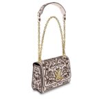max. 56 cm – 22.0 inches) with leather pad for shoulder or cross-body carry•Transforming signature LV twist-lock•Inside flat pocket with removable mirror•Large inside pocket