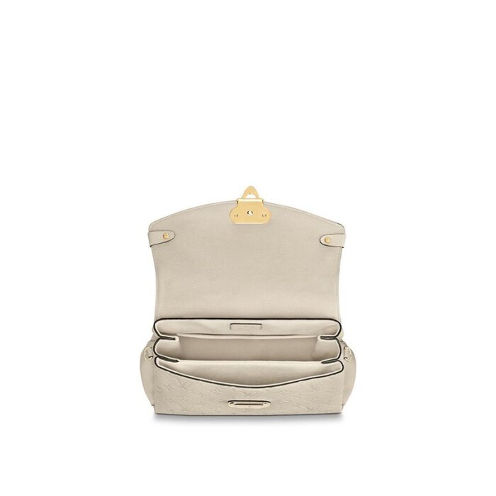 timeless day bag for the active woman.Detailed Features10.83 x 6.69 x 4.53 inches(Length x Height x Width)•Crème Beige•Embossed supple grained cowhide leather and supple grained cowhide leather•Supple grained cowhide leather trim•Microfiber lining•Gold-color hardware•Magnetic signature lock•Top handle for hand or elbow carry•Removable