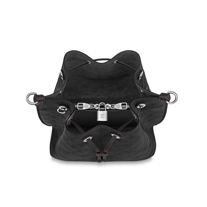 a perforated leather with a discreet Monogram motif. Supple and sophisticated