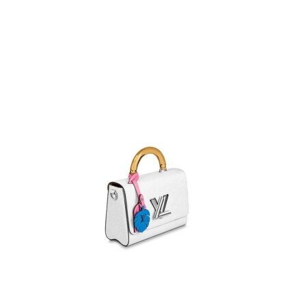 Louis Vuitton fashions the Twist MM in deep-dyed Epi leather with a colored plexiglass top handle and bright-colored nametag and charm. Accented by the classic LV Twist lock