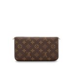 it can be transformed into a glamorous shoulder bag or clutch thanks to its removable golden chain.Detailed Features•8.4 x 4.5 x 1.2 inches•Coated Canvas exterior•Coated Canvas & Cowhide Leather trim•Contrasted textile lining•Shiny gold colored metallic pieces•Inside flat pocket•Large compartment•2 removable parts: zip pocket & flat pocket with 8 credit card slots•Removable golden metallic chain for shoulder or cross-body carry•Press-stud closure•Made in France or Made in Spain