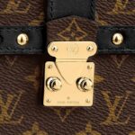 an S-lock clasp and a Malletage pattern on the inside pocket. It features a removable