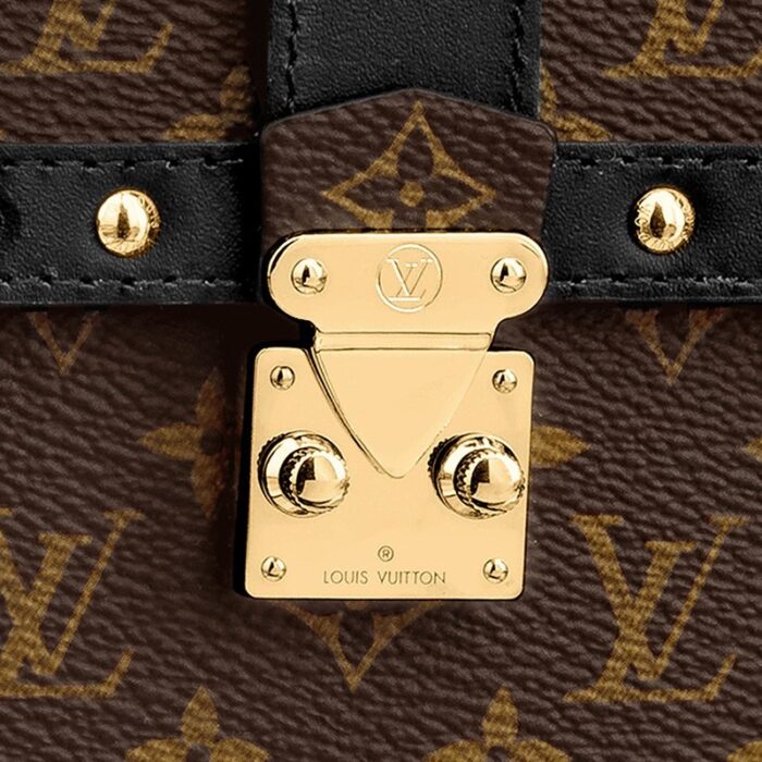 an S-lock clasp and a Malletage pattern on the inside pocket. It features a removable