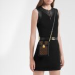 adjustable shoulder strap.Detailed Features4.33 x 6.89 x 1.38 inches(Length x Height x Width)•Black•Monogram coated canvas and calf leather•Calf-leather lining•Gold-color hardware•Removable