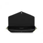 this envelope-style pouch contains a spacious compartment with two removable pockets: one zipped