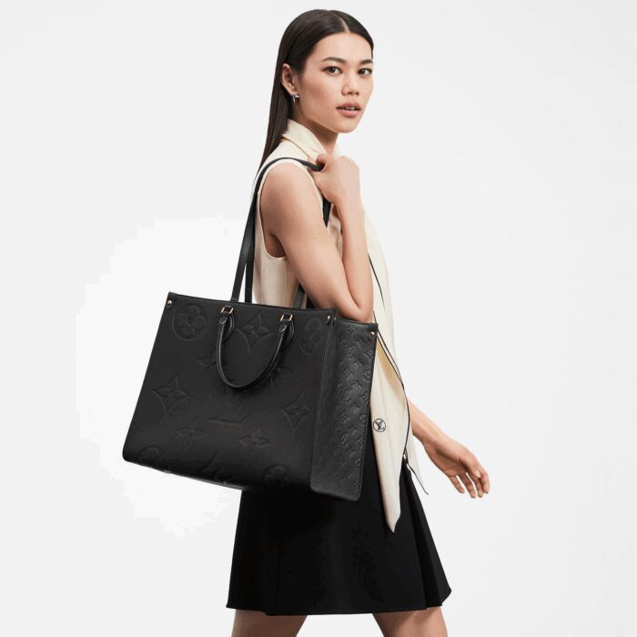 sans-serif; font-size: 16px; background-color: #ffffff;">The stylishly oversized OnTheGo GM tote goes from workday to weekend without missing a beat. The bag’s square shape affords plenty of room for stowing office files and a laptop. For the first time